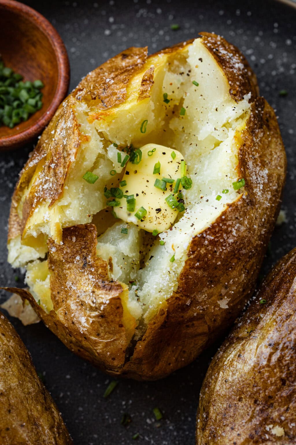 crispy air fryer baked potato — fluffy inside, golden outside