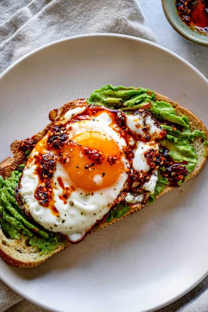 avocado toast with eggs & chili butter — spicy & satisfying brunch