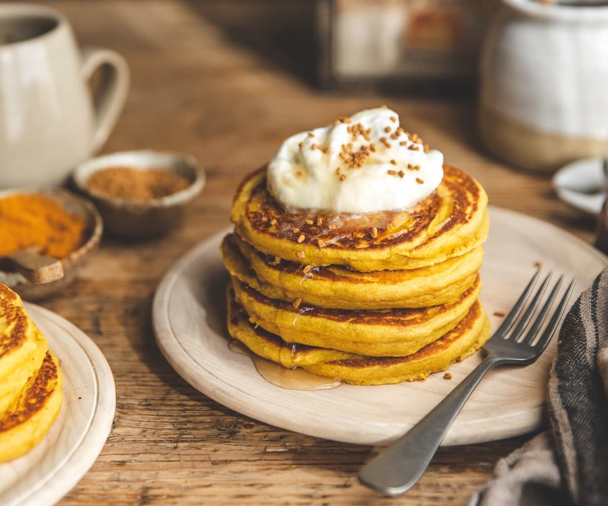 turmeric golden latte pancakes — coconut cream & warm spice stack